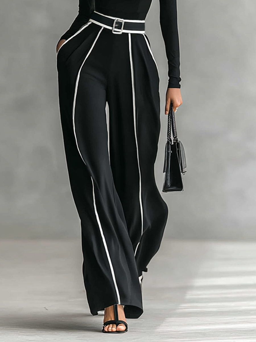 Tweedelig pak met coltrui en wijde broek met riem